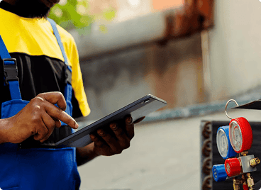 Workers installing metering equipment